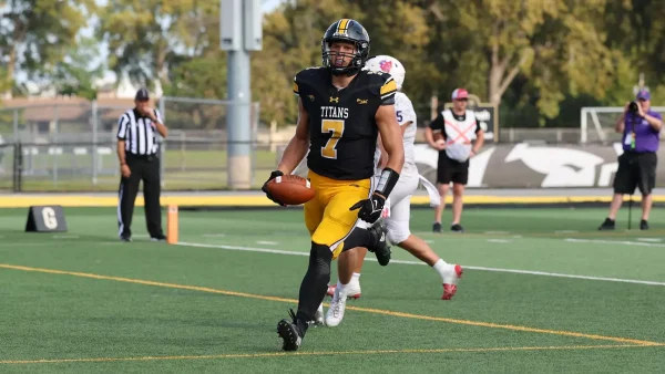 Courtesy of Steve Fromell / UWO Athletics – UWO’s Clayton Schwalbe hauls in a touchdown in the game against Linfield last season.