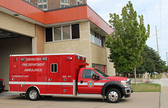 Courtesy of the Oshkosh Fire Department – An Oshkosh Fire Department ambulance sits outside the station on Court Street. OFD recently announced its plans to cut ambulance service to numerous neighboring towns.