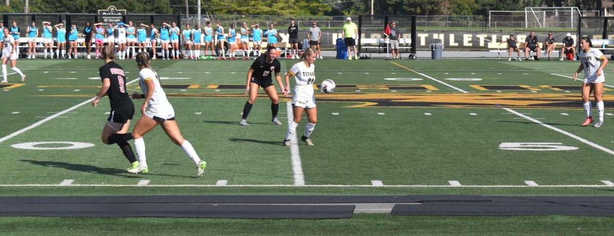 Zach Bellin / Advance-Titan – UWO’s Brynn Higgins receives a pass in the middle of the field at J.J. Keller Field at Titan Stadium in UWO’s 2-1 win over Saint Benedict. 