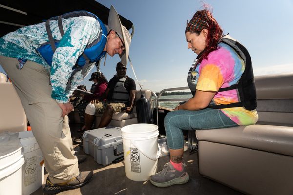Courtesy of UWO Flickr – Members of the harmful algal bloom research team take water samples from Lake Winnebago at various locations in August.