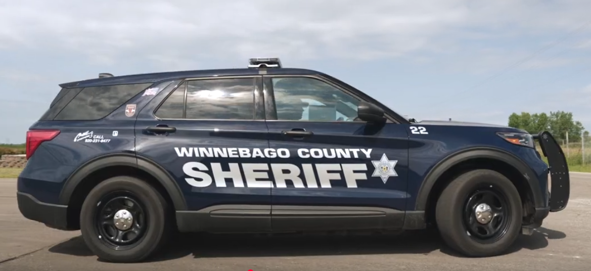 Courtesy of the Winnebago County Sheriff’s Office – A Winnebago County Sheriff’s Office patrol car sits outside a garage.