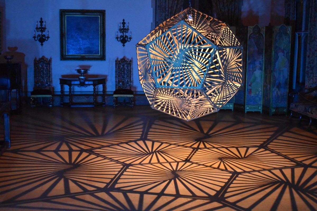 McKenzie Moore / Advance-Titan
One of many unique designs by HYBYCOZO adorns the Great Hall in the Paine Art Center mansion with patterns made with light and shadow.
