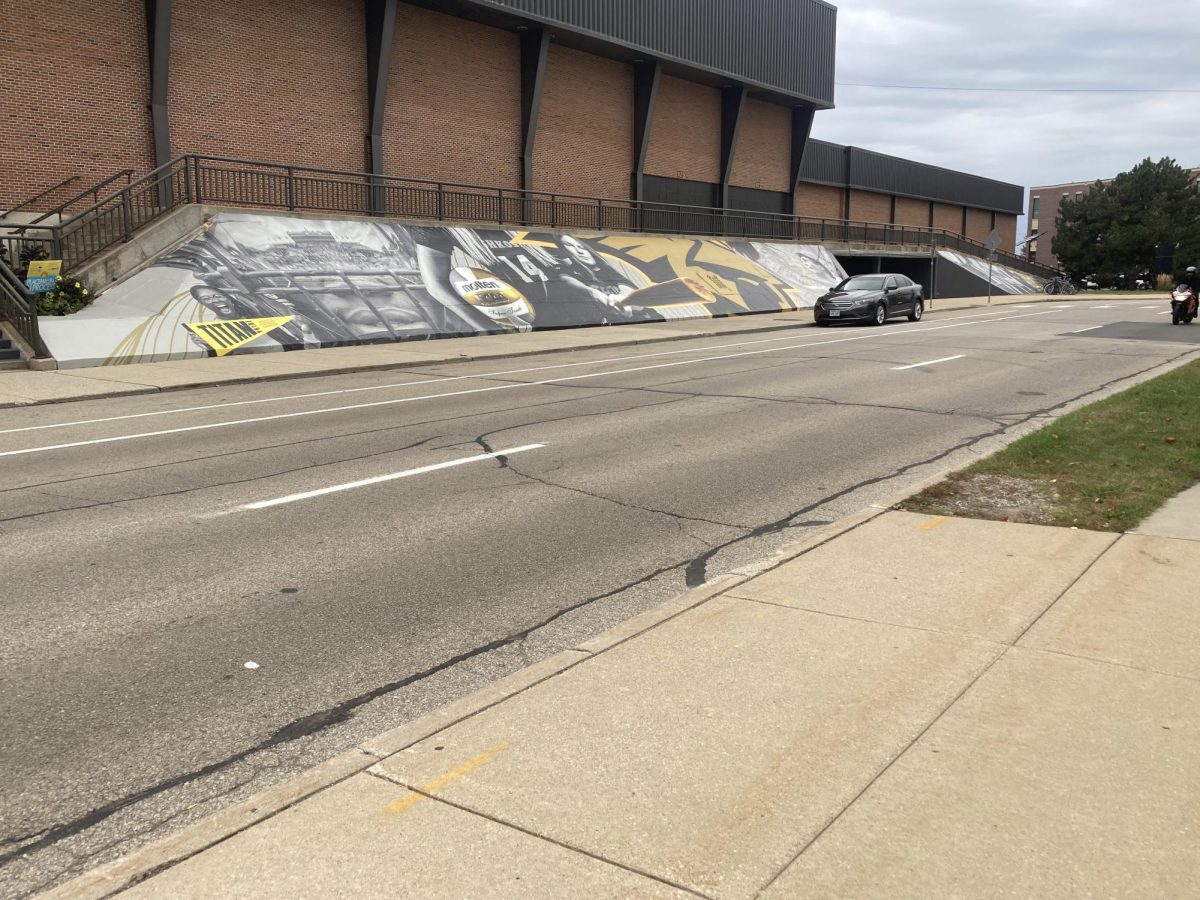 Isaac Pischer / Advance-Titan – A new wrap on Kolf Sports Center, which celebrates past Titan Athletes, was completed in time for UWO’s 100th Homecoming on Oct. 18.