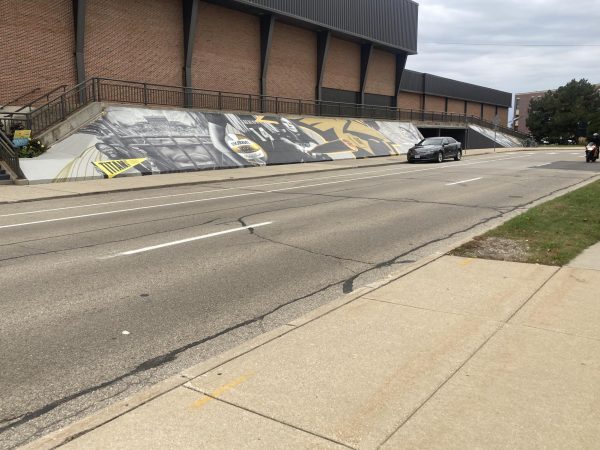 Isaac Pischer / Advance-Titan – A new wrap on Kolf Sports Center, which celebrates past Titan Athletes, was completed in time for UWO’s 100th Homecoming on Oct. 18.