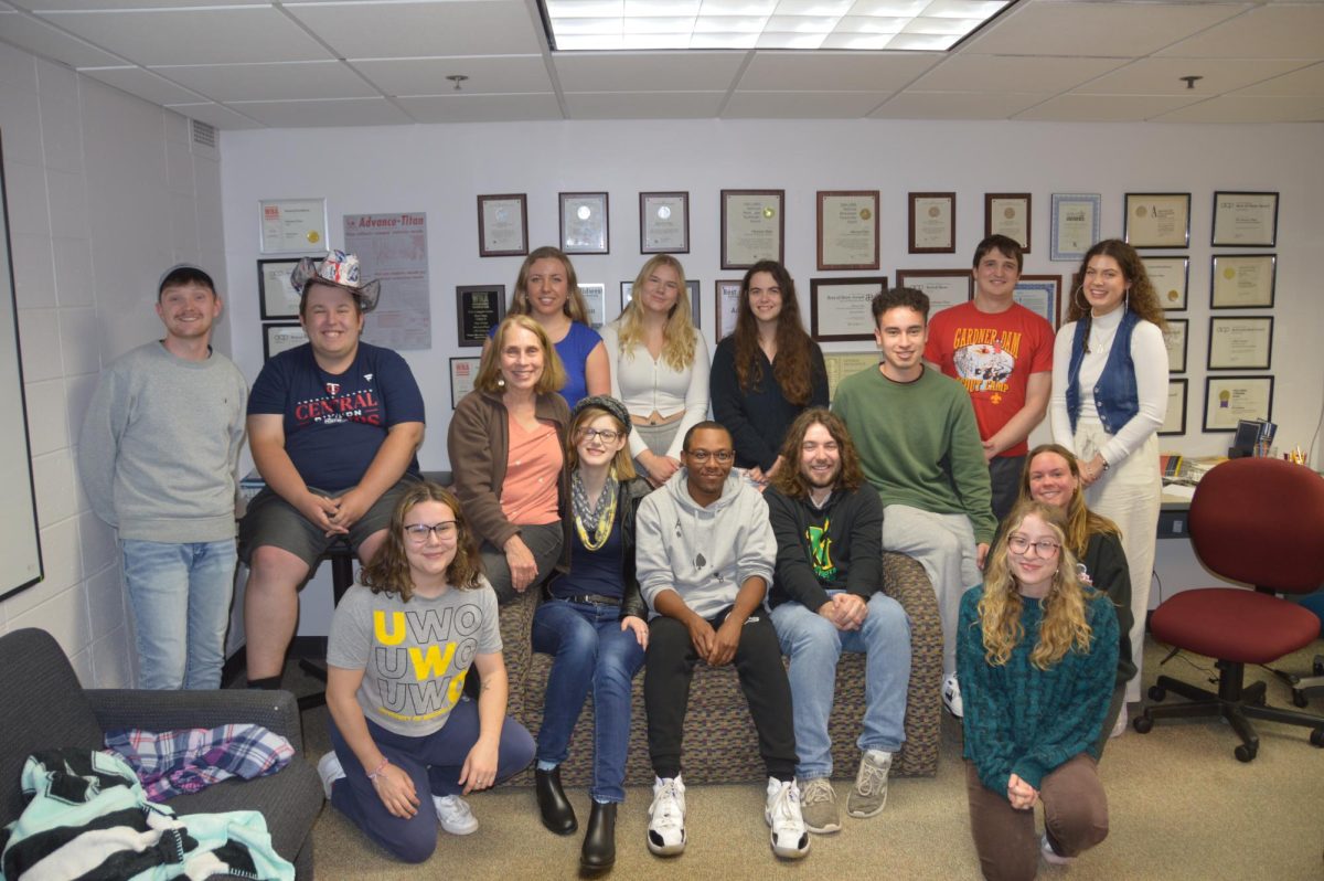 A-T File Photo – Angela Satterlee (lower left) poses for a picture with the Advance-Titan staff.