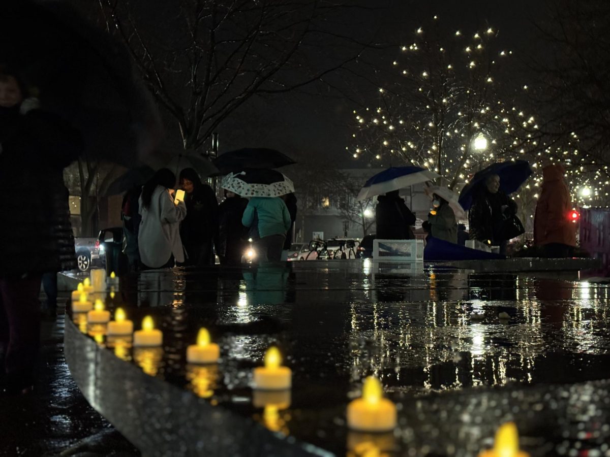 Vladyslav Plyaka / Advance-Titan – People gather in downtown Oshkosh at the Opera House Square for “A Candlelight Vigil” to commemorate Renee Nicole Good on Jan. 8. 
