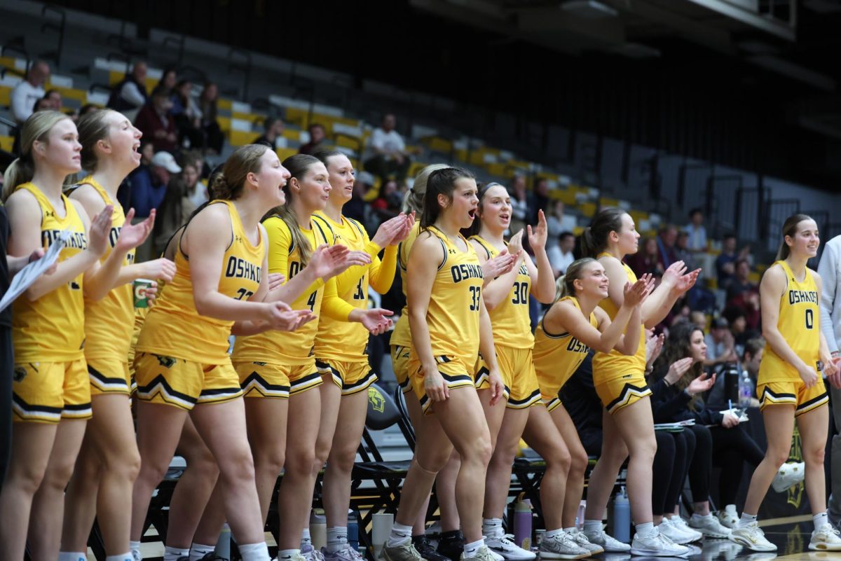 Courtesy of Steve Frommell / UWO Athletics -- UWO's bench celebrates after Oshkosh converts a basket Feb. 18.