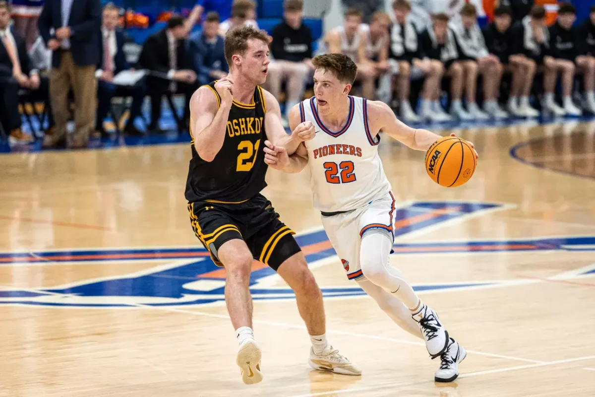Courtesy of UW-Platteville Athletics - UWO’s Carter Thomas tries to guard Platteville’s Max Lucy in the Titans’ 72-79 loss to UW-Platteville in the WIAC tournament on Feb. 24. 