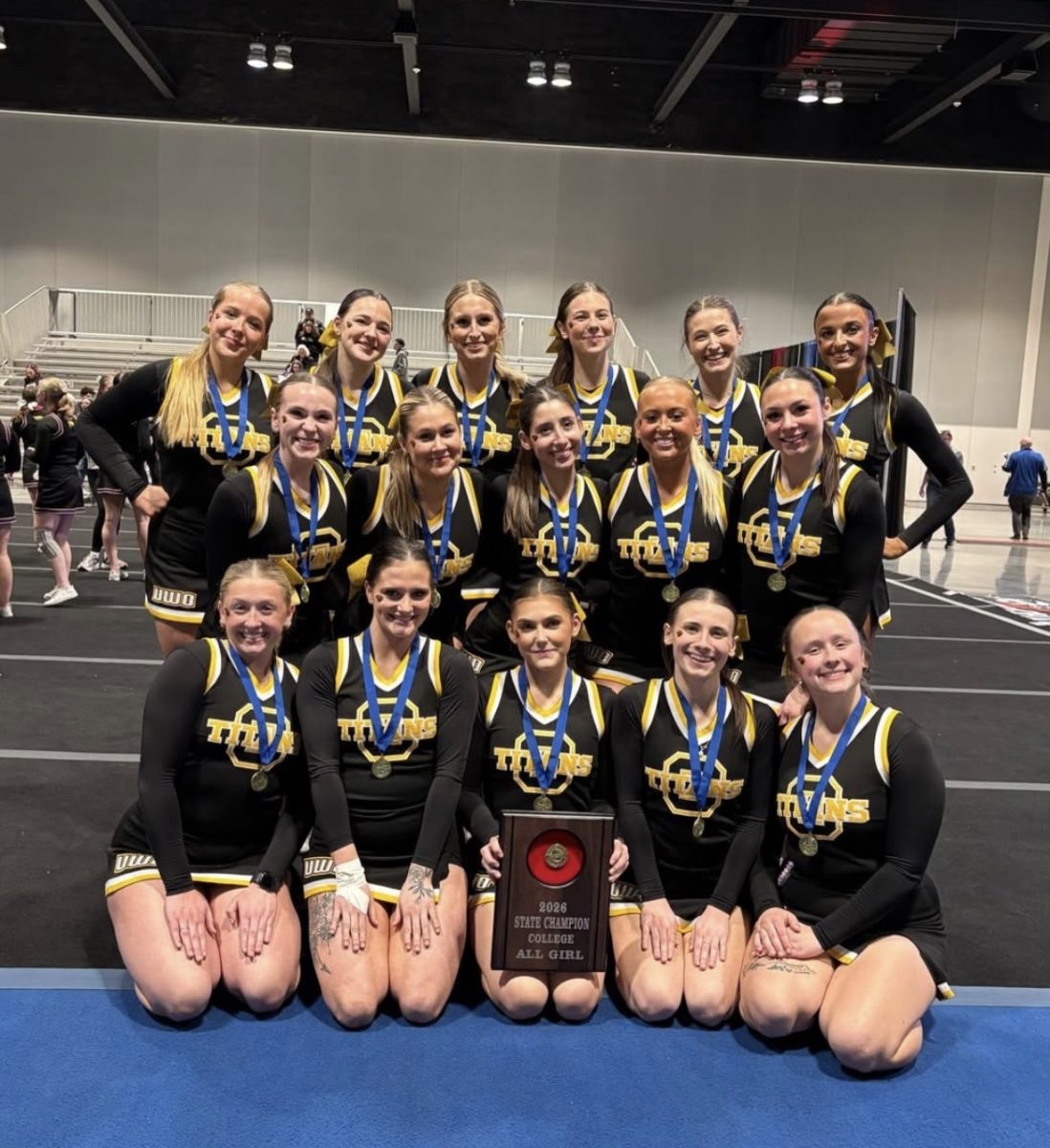 Courtesy of UWO Cheer and Stunt - The UWO Cheer and Stunt Club poses after winning state.
