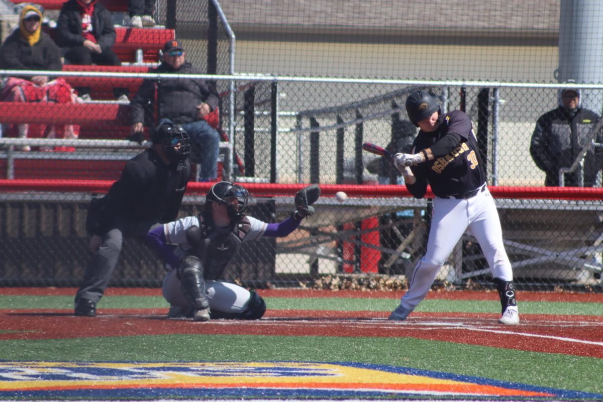 Katie Lechton / The Advance-Titan - Brayden Skenandore swings at a pitch during UWO's game against UW-Stevens Point on April 5 at Wisconsin Rapids Lincoln High School.