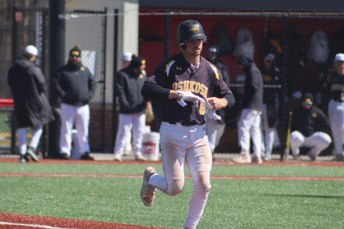Katie Lechton / The Advance-Titan - Logan Schill advances to first base during UWO's game against UW-Stevens Point on April 5 at Wisconsin Rapids Lincoln High School.