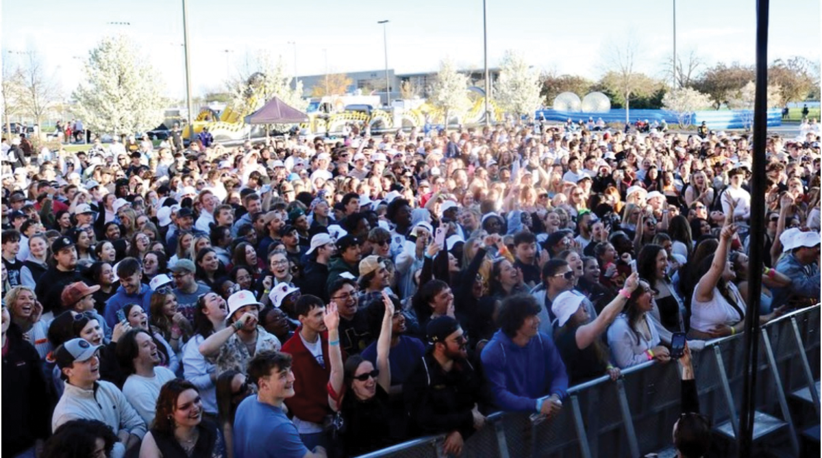 Courtesy of Reeve Union Board - A crowd full of UW-Oshkosh students dance and sing along to last year’s headliner, Waka Flocka Flame, at the annual Bye Gosh Fest outside of the Kolf Sports Center.
