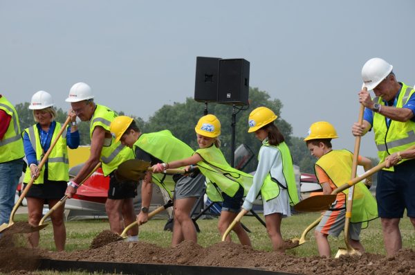 Vladyslav Plyaka / Advance-Titan -- EAA volunteers and staff participate in the Discovery Park groundbreaking ceremony on the opening day of AirVenture 2026.  