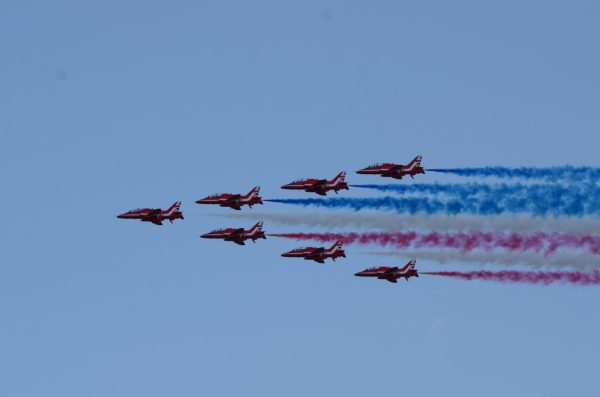 Vladyslav Plyaka / Advance-Titan --- The Red Arrows aerobatic team flies over the EAA AirVenture 2026, leaving red, white and blue smoke trails behind them on Wednesday, July 22.